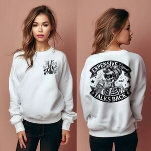 White long sleeve shirt with graphic skull design.